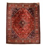 A JOSHEGHAN CARPET, PERSIA, MODERN the red field with a black stepped diamond medallion and