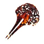 A CHINESE TORTOISE SHELL HAIR PIN NOT SUITABLE FOR EXPORT pierced with a peony and scrolling