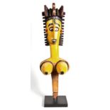 A BAMBARA MARIONETTE, MALI the painted female figure with elaborately carved and decorated