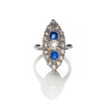 A SAPPHIRE AND DIAMOND RING centred with an old-cut diamond weighing approximately 0.24cts and two