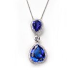 A TANZANITE AND DIAMOND PENDANT of articulated design with two opposing pear-shaped mixed-cut