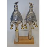 A NEAR PAIR OF SILVER TORAH FINIALS, UNMARKED each domed body with the Star of David and a pair of