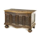 A DUTCH OAK AND METAL-BOUND KIST, 18TH CENTURY the hinged carved rectangular top enclosing