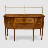 A GEORGE III MAHOGANY, CROSSBANDED AND BRASS-MOUNTED SIDEBOARD the rectangular bowfronted top