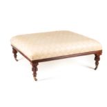 A WILLIAM IV MAHOGANY OTTOMAN the stuff-over seat above a reeded frieze, on gadrooned turned