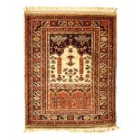 A KURDI RUG, WEST PERSIA, MODERN in the "ladik" style, with ivory mehrabs with twin columns,