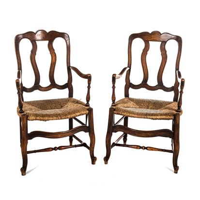 A PAIR OF FRUITWOOD RUSH SEAT ARMCHAIRS each shaped top and bottom rail joined by a pair of shaped