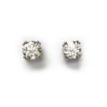 A PAIR OF DIAMOND EAR STUDS each claw set with a brilliant-cut diamond weighing approximately 1.
