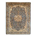 A KHOROSSAN CARPET, PERSIA, MODERN the blue field with a pale blue-and-gold floral star medallion,