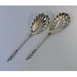 A PAIR OF EDWARDIAN SILVER SERVING SPOONS, WILLIAM HUTTON & SONS LTD, LONDON, 1906 each shell-shaped