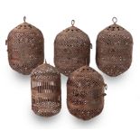 FIVE MOROCCAN RUSTIC IRON-WORK LANTERNS, 20TH CENTURY each of oval shape with pierced decoration