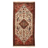 AN ABADEH PRAYER RUG, SOUTH WEST PERSIA, MODERN the ivory field with a black stepped diamond