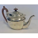 AN EDWARDIAN SILVER TEAPOT, CRICHTON BROTHERS, LONDON, 1907 the oval body engraved with initials,