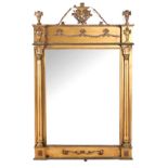 AN EDWARDIAN GILTWOOD MIRROR the rectangular plate within a conforming surround flanked by fluted