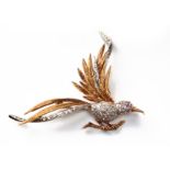 A DIAMOND BROOCH in the form of a bird on a branch, embellished with senaille-cut diamonds and a