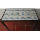 A DUTCH DELFT BlUE AND WHITE TILE AND METAL LOW TABLE rectqangular, comprising 12 blue and white