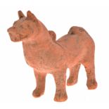 A CHINESE TERRACOTTA FIGURE OF A STANDING DOG, HAN DYNASTY standing foursquare with a harness and