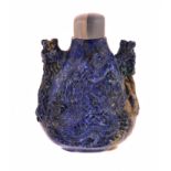 A CHINESE LAPIS LAZULI SNUFF BOTTLE, LATE 19TH CENTURY carved in two parts, the front and reverse
