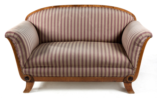 A BIEDERMEIER WALNUT SETTEE the padded back beneath a curved top rail, curved padded arms, stuff-