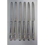 A SET OF SIX SILVER KNIVES, MAKERS MARK MB, LONDON, 1814 each engraved with a crest, 380g in