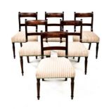 A SET OF SIX REGENCY MAHOGANY SIDE CHAIRS each curved reeded top rail above a conforming mid-rail