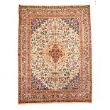 A TABRIZ CARPET, NORTH WEST PERSIA, MODERN the ivory field with a pale gold and red floral