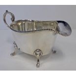 A GEORGE V SILVER SAUCE BOAT, BROOK & SON, SHEFFIELD, 1929 the boat-shaped body with gadrooned