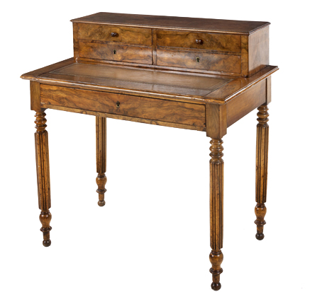 A WILLIAM IV WALNUT ESCRITOIRE the moulded rectangular top with a sliding gilt-tooled leather-