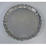 A GEORGE V SILVER SALVER, BARKER BROTHERS SILVER LTD, BIRMINGHAM, 1930 the circular body with pie-