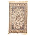 AN ISPAHAN RUG, PERSIA, MODERN the ivory field with a blue-and-gold floral star medallion, similar