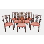 A SET OF EIGHT CHIPPENDALE STYLE MAHOGANY DINING CHAIRS RETAILED BY JOHN PLUMMER, LONDON comprising: