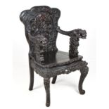 A JAPANESE EXPORT LACQUERED DRAGON ARMCHAIR, 20TH CENTURY the shaped back elaborately carved with