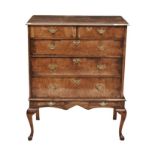 A QUEEN ANNE WALNUT CHEST-ON-STAND in two parts, the associated rectangular top above a pair of