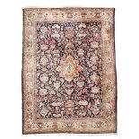 A SAROUK CARPET, WEST PERSIA, MODERN the dark blue field with a red floral medallion, all with