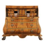 A FLAME MAHOGANY CYLINDER BOMBÉ BUREAU, 19TH CENTURY the rectangular top above a sliding curved