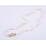 A PEARL NECKLACE princess length, composed of a single strand of sixty pearls, approximately 6,5mm