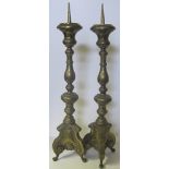 A PAIR OF BRASS ALTAR CANDLEHOLDERS 84cm high (2)