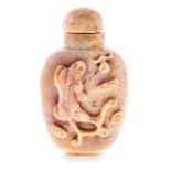 A CHINESE CARVED OPAL SNUFF BOTTLE AND STOPPER the ovoid body carved in high relief on one side with