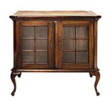 A CAPE STINKWOOD DISPLAY CABINET, LATE 19TH/EARLY 20TH CENTURY the rectangular top above a pair of