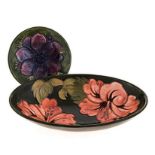 A MOORCROFT ‘HIBISCUS’ PATTERN DISH, 1950’s oval, green ground, painted initials, impressed