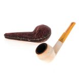 A CASED MEERSCHAUM PIPE, VIENNA, EARLY 20TH CENTURY the plain bowl with "amber" resin stem, the case