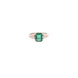 AN EMERALD AND DIAMOND RING claw-set to the centre with a square emerald-cut emerald weighing 1.
