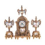 A FRENCH GILT-BRASS AND PAINTED PORCELAIN CLOCK GARNITURE, 19TH CENTURY the 9cm circular painted