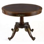 A FRENCH ROSEWOOD TILT-TOP TABLE, 19TH CENTURY the circular top above a gilt-metal mounted apron