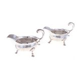 A PAIR OF GEO II SILVER SAUCEBOATS, THOMAS COOKE II & RICHARD GURNEY, LONDON, 1751 with leaf-