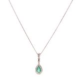 AN EMERALD AND DIAMOND PENDANT centred with an oval mixed-cut emerald weighing 1.46cts, within a