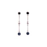 A PAIR OF SAPPHIRE AND DIAMOND PENDENT EARRINGS each designed as an articulated bar with two round