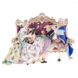 A MEISSEN PORCELAIN GROUP OF TWO MUSCIANS SEATED ON A CANAPE, 19TH CENTURY the lady and her