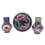 A GROUP OF THREE MOORCROFT ‘ANEMONE’ PATTERN WARES, 1950s comprising: 2 vases of baluster outline
