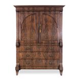 A FLAME MAHOGANY ARMOIRE, 19TH CENTURY in two parts, the outswept cornice above a plain frieze, a